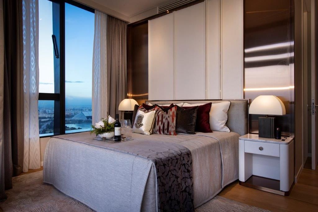 The master bedroom looks out to enviable views of the city skyline