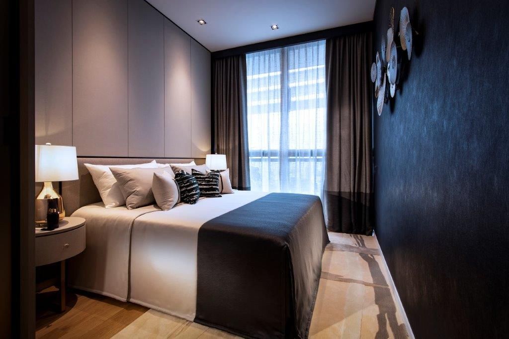 Textured wallpaper and a wall-hung art piece brings a new dimension to this bedroom