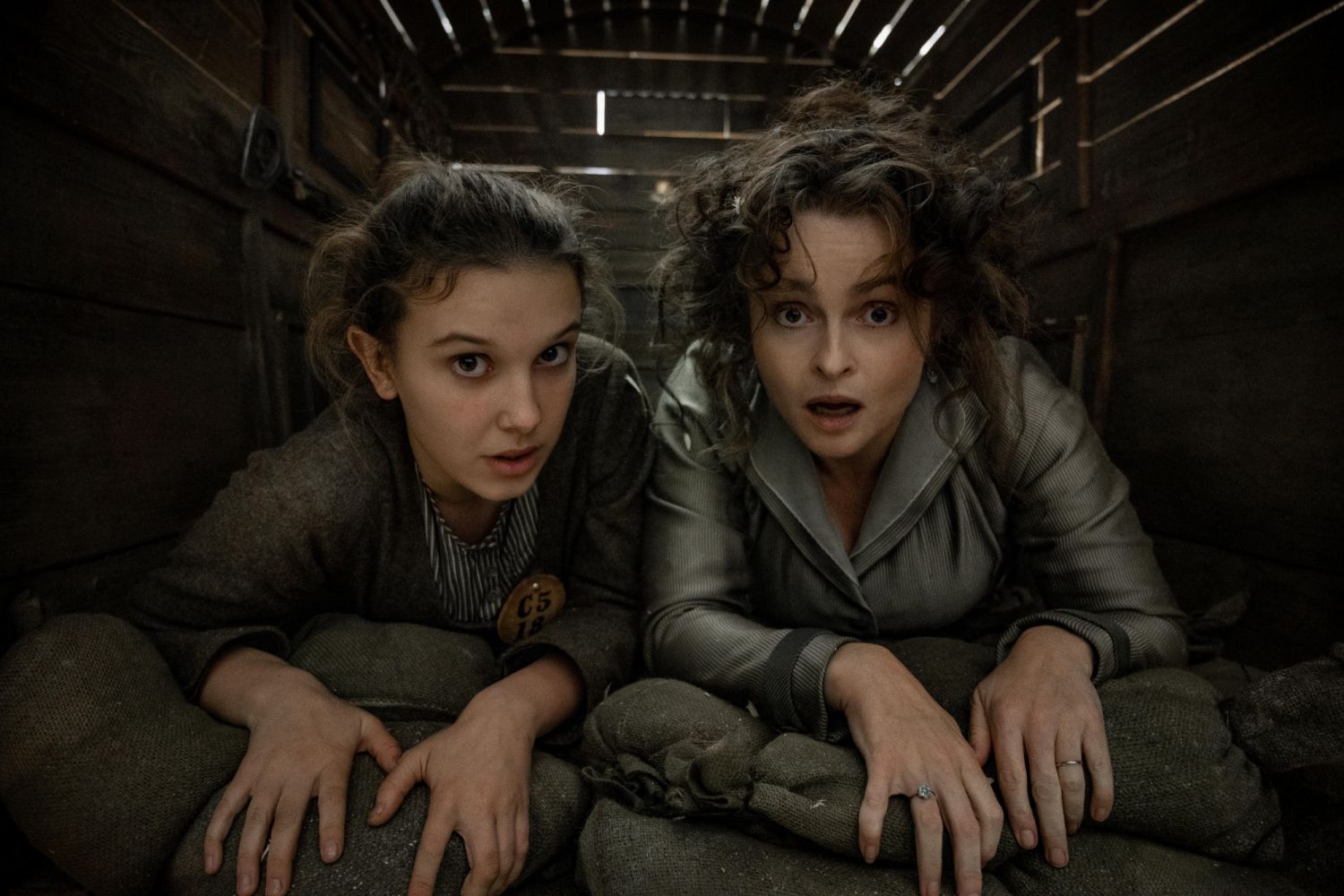 Enola Holmes 2. Millie Bobby Brown as Enola Holmes, Helena Bonham Carter as Eudoria Holmes. Cr. Alex Bailey/Netflix Â© 2022