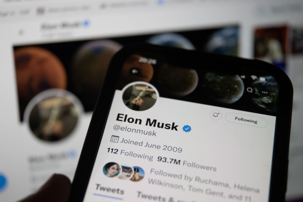 BRISTOL,ENGLAND - MAY 8:  In this photo illustration a man looks at Elon Musk's Twitter account that is displayed on a smartphone screen on May 08, 2021 in Bristol, England. Billionaire entrepreneur Elon Musk has said his multi billion dollar deal to buy Twitter may not now happen due to a disagreement over the number of fake accounts on the social media platform. (Photo by Matt Cardy/Getty Images)