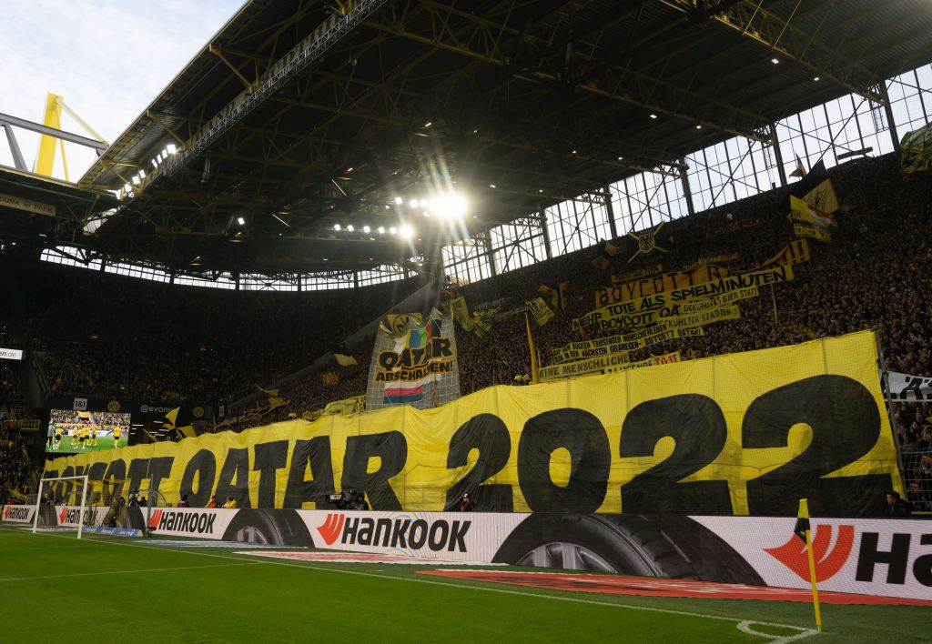 05 November 2022, North Rhine-Westphalia, Dortmund: Soccer: Bundesliga, Borussia Dortmund - VfL Bochum, Matchday 13, Signal Iduna Park: Dortmund's fans call for a boycott of the 2022 World Cup in Qatar on banners. Photo: Bernd Thissen/dpa - IMPORTANT NOTE: In accordance with the requirements of the DFL Deutsche FuÃball Liga and the DFB Deutscher FuÃball-Bund, it is prohibited to use or have used photographs taken in the stadium and/or of the match in the form of sequence pictures and/or video-like photo s