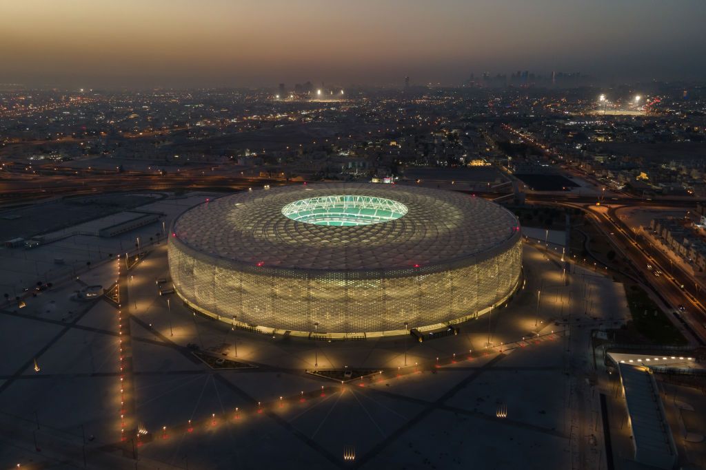 DOHA, QATAR - JUNE 22: (EDITORS NOTE: This photograph was taken using a drone) An aerial view of Al Thumama stadium at sunset on June 22, 2022 in Doha, Qatar. Designed by the architect Ibrahim M. Jaidah, the stadiumâs bold, circular form reflects the gahfiya â a traditional woven cap adorned by men and boys all across the Middle East for centuries. Al Thumama stadium is a host venue of the FIFA World Cup Qatar 2022 starting in November. (Photo by David Ramos/Getty Images)