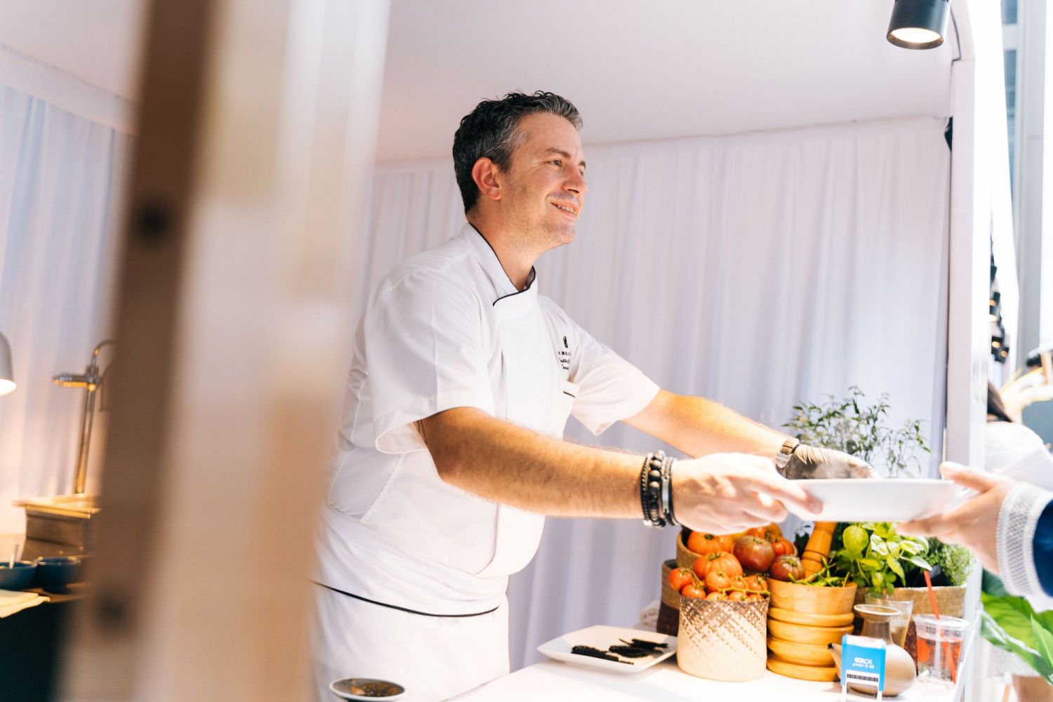 Mattia Salussoglia serving guests his assam pedas acqua pazza grouper, which was a hit with many guests