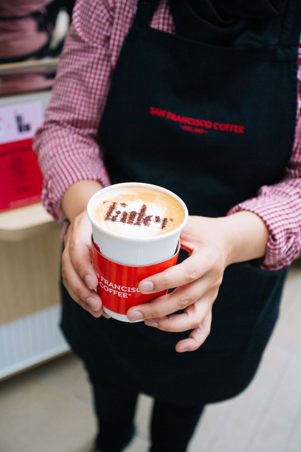 Hot cups of coffee from San Francisco Coffee came topped with a cocoa powder stencil of the Tatler logo.
