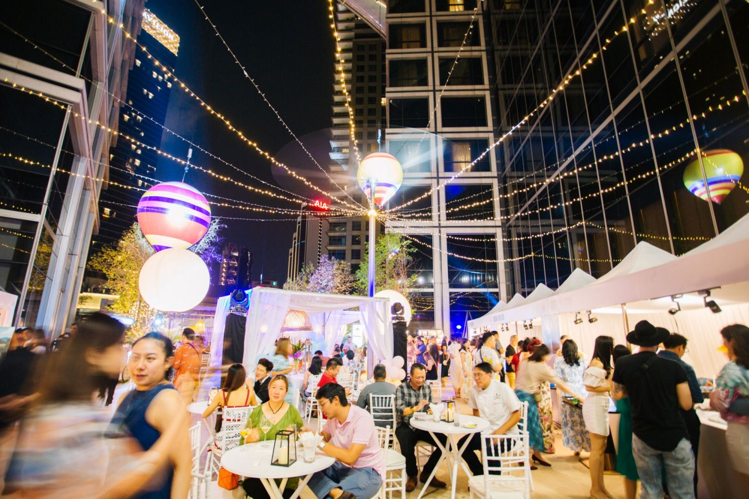 As night fell on the courtyard, the space transformed into a vibrant tropical-themed party