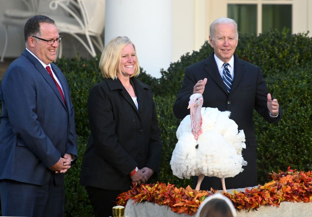 WASHINGTON, DC - NOVEMBER 19: U.S. President Joe Biden pardons the turkey 'Peanut Butter' as Andrea Welp (C), turkey grower from Indiana, and Phil Seger, chairman of the National Turkey Federation, look on during the 74th annual Thanksgiving turkey pardoning in the Rose Garden of the White House on November 19, 2021 in Washington, DC. (Photo by Chen Mengtong/China News Service via Getty Images)