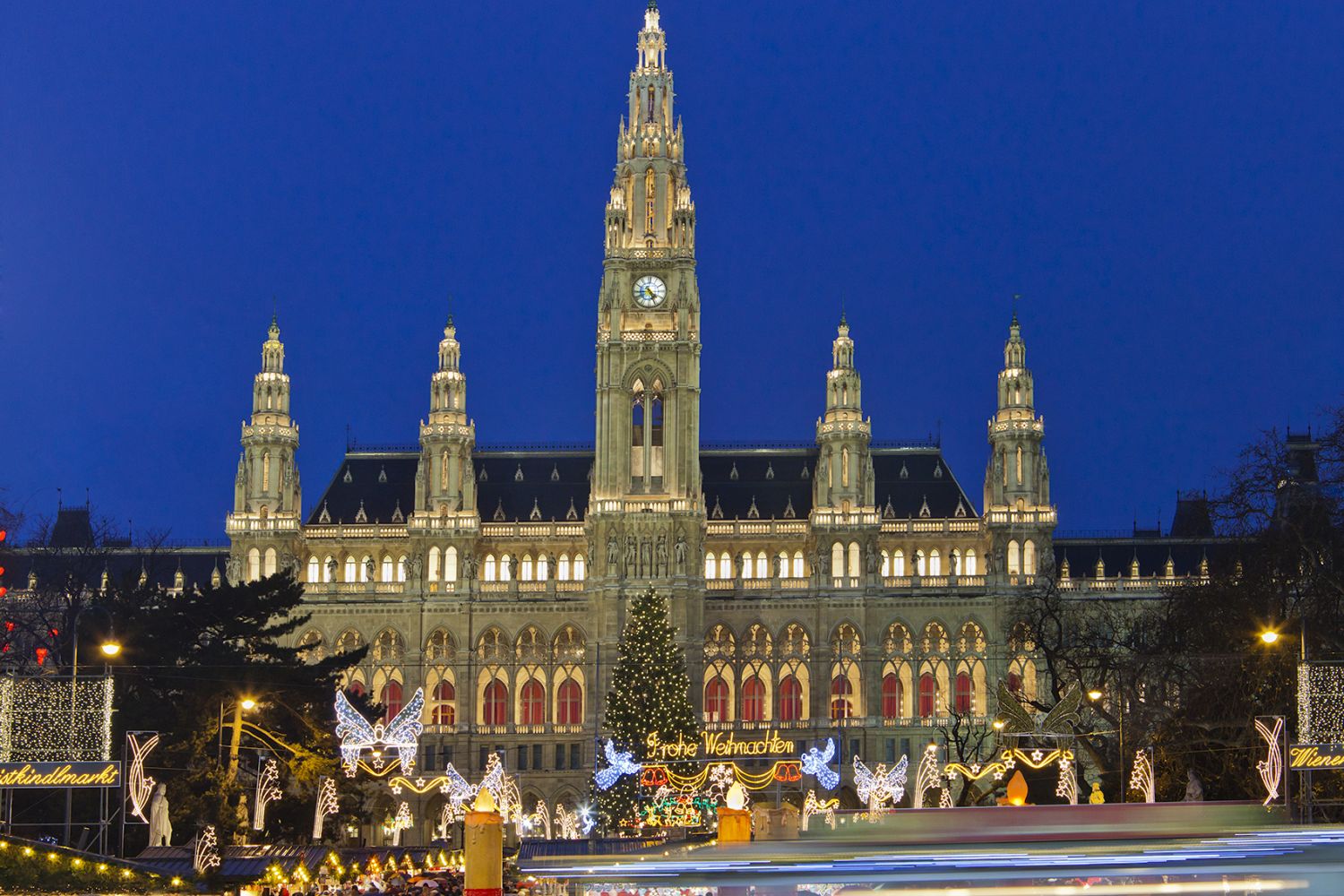 The Christkindlmarkt in the Rathausplatz is the most important Christmas Market among the numerous of the city. On the small colorful market stalls you can find ideas for Christmas presents, or traditional Austrian food and sweets with mulled wine ("Glühwein") and Christmas punch. In the background stands the imposing Vienna City Hall, a beautiful example of Gothic Revival architecture. Vienna, Austria. Canon EOS 5D Mark II