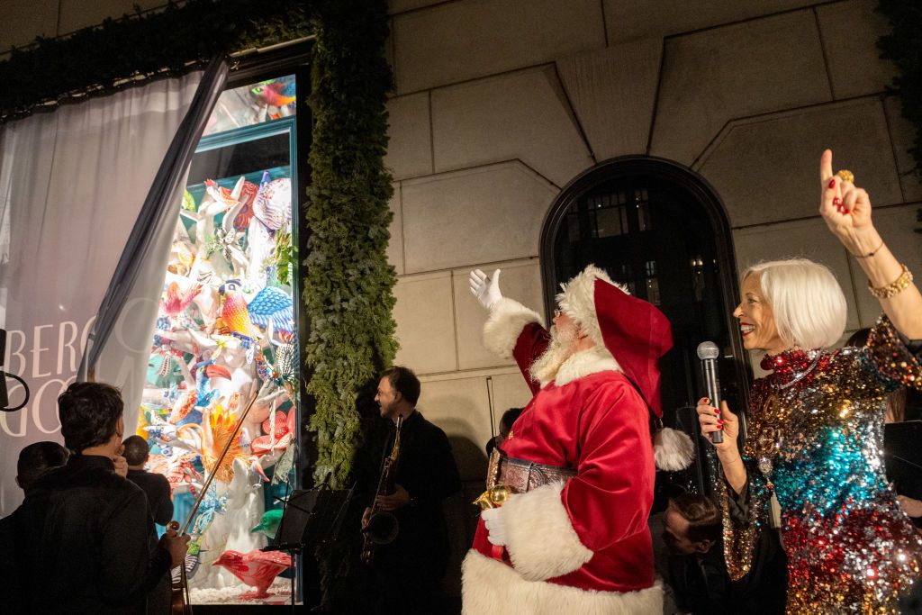 NEW YORK, NEW YORK - NOVEMBER 18: Bergdorf Goodman Fashion Director Linda Fargo (R), and Santa Claus cheer at the Bergdorf Goodman Holiday Windows unveiling on November 18, 2021 in New York City. This yearâs theme is âThe Present Moment," which celebrates the beauty of life and the importance of living in a more purposeful manner. (Photo by Alexi Rosenfeld/Getty Images)