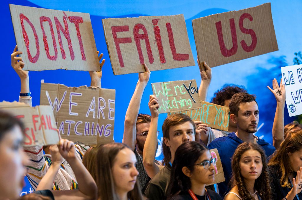 Participants in a demonstration at the UN Climate Summit COP27 hold placards and advocate for the 1.5 degree Celsius global temperature rise target (Photo: Christophe Gateau/picture alliance via Getty Images)