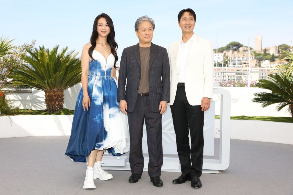 CANNES, FRANCE - MAY 23: (L to R) Tang Wei, Director Park Chan-wook and Park Hae-il attend the screening of "Decision To Leave (Heojil Kyolshim)" during the 75th annual Cannes film festival at Palais des Festivals on May 23, 2022 in Cannes, France. (Photo by Stephane Cardinale - Corbis/Corbis via Getty Images)