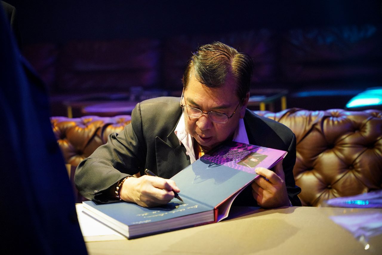 Louie Ysmael one of his books