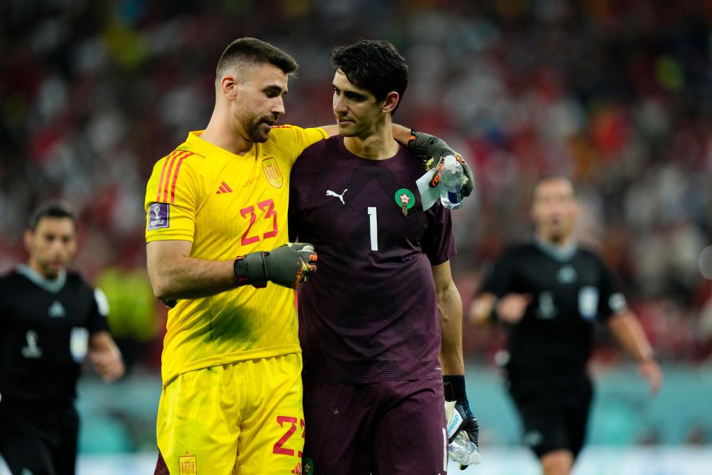 Unai Simon goalkeeper of Spain and Athletic Bilbao and Bono goalkeeper of Morocco and Sevilla FC before the penalty shoot out during the FIFA World Cup Qatar 2022 Round of 16 match between Morocco and Spain at Education City Stadium on December 6, 2022 in Al Rayyan, Qatar. (Photo by Jose Breton/Pics Action/NurPhoto via Getty Images)
