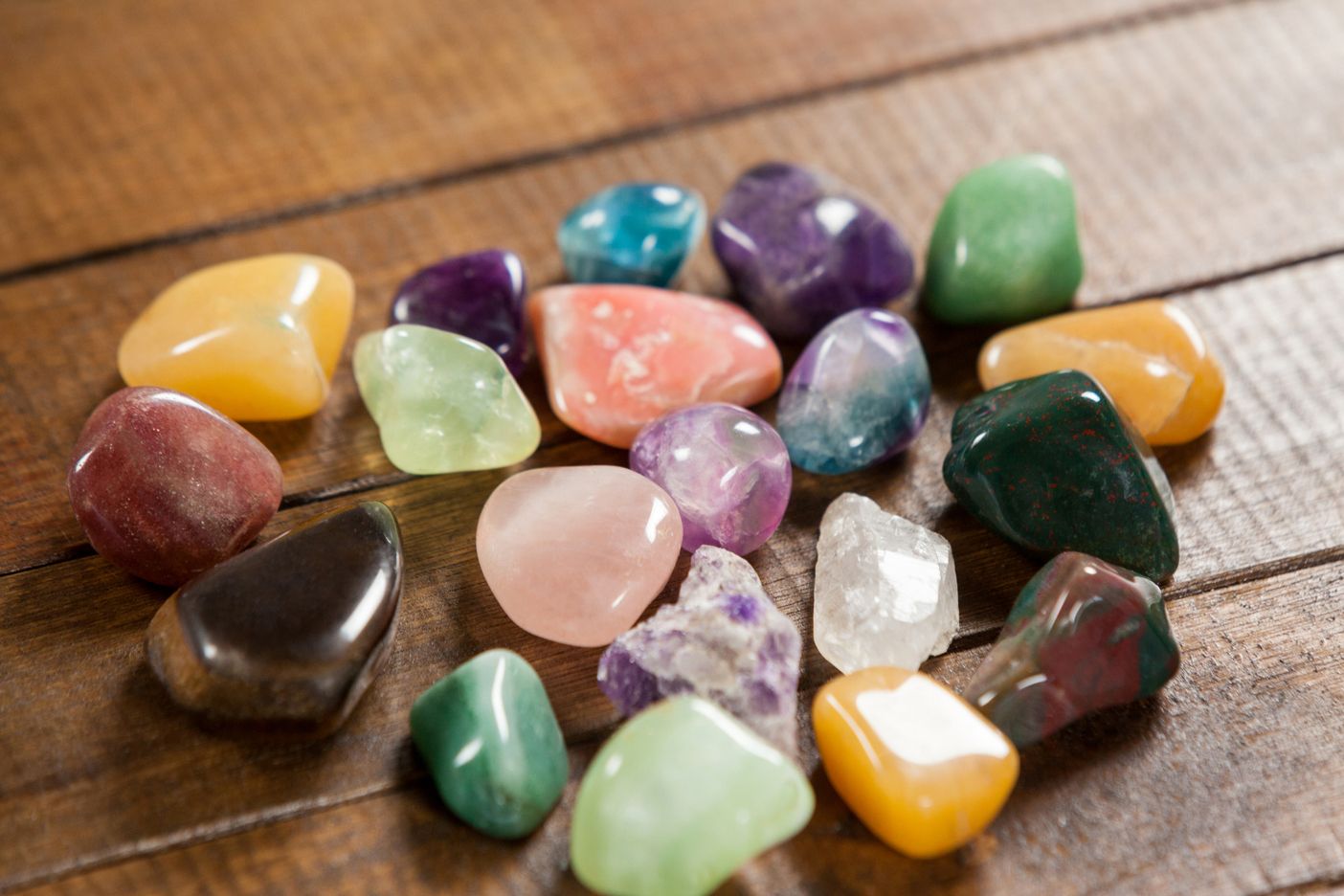 Colorful pebbles stones on wooden table