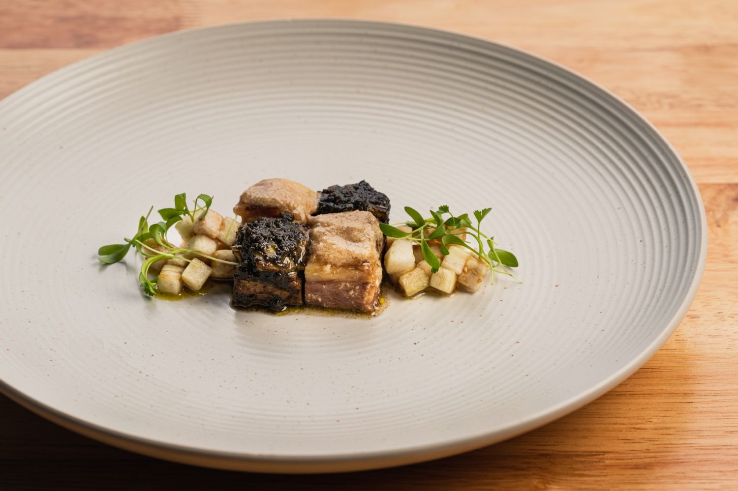 Moros y Kristiano: slow-braised short ribs with traditional white gata and Tausug-style black burnt coconut sauce