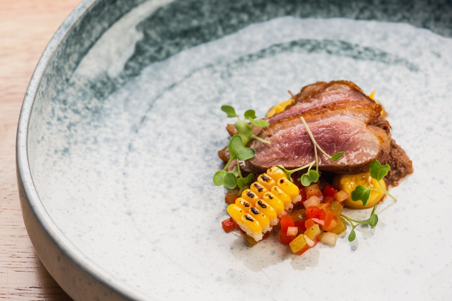 Pato con salsa txokolate: a duo of duck with Tablea-infused sauce and grilled corn salsa