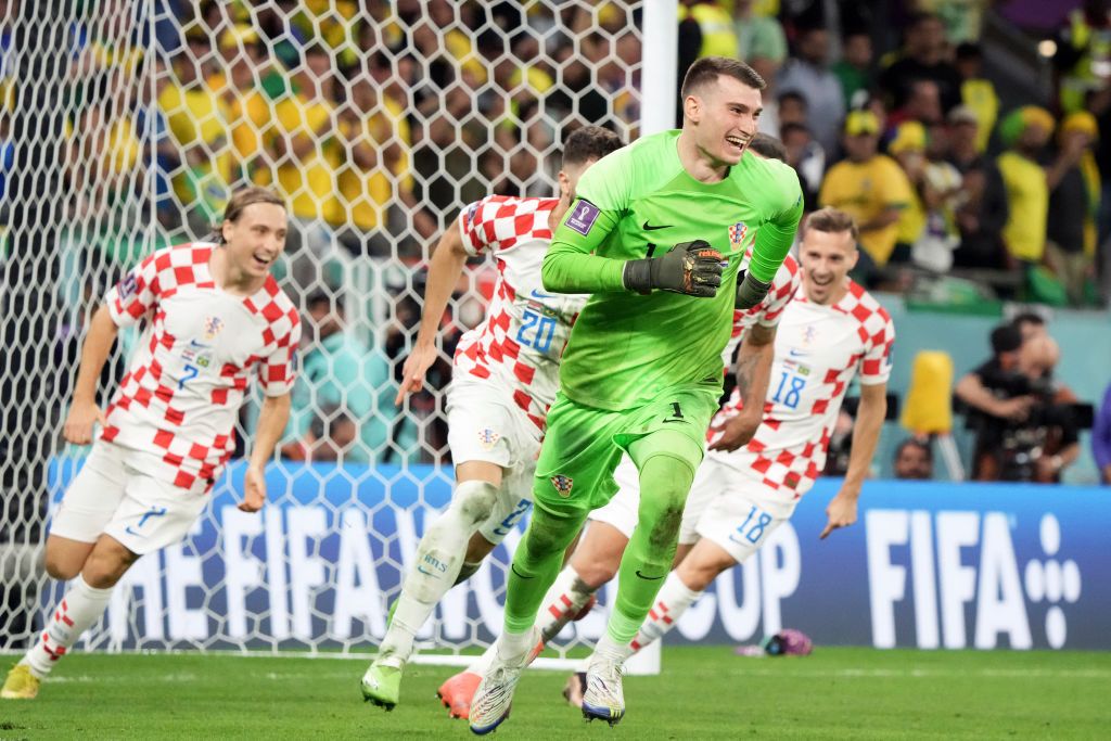 AL RAYYAN, QATAR - DECEMBER 09: Dominik Livakovic of Croatia celebrates the win via a penalty shootout during the FIFA World Cup Qatar 2022 quarter final match between Croatia and Brazil at Education City Stadium on December 09, 2022 in Al Rayyan, Qatar. (Photo by Koji Watanabe/Getty Images)