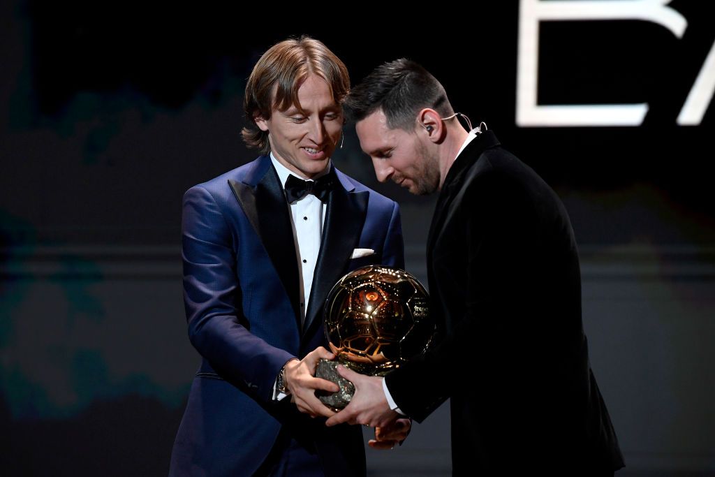 PARIS, FRANCE - DECEMBER 02: Lionel Messi (ARG / FC Barcelona) excepts his sixth Ballon D'Or award from Luka Modric during the Ballon D'Or Ceremony at Theatre Du Chatelet on December 02, 2019 in Paris, France. (Photo by Kristy Sparow/Getty Images)