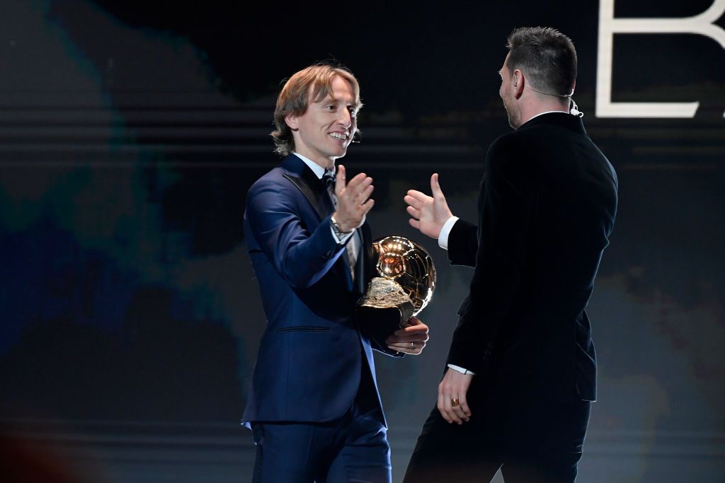 PARIS, FRANCE - DECEMBER 02: Lionel Messi (ARG / FC Barcelona) excepts his sixth Ballon D'Or award from Luka Modric (Croatia / Real Madrid) during the Ballon D'Or Ceremony at Theatre Du Chatelet on December 02, 2019 in Paris, France. (Photo by Kristy Sparow/Getty Images)