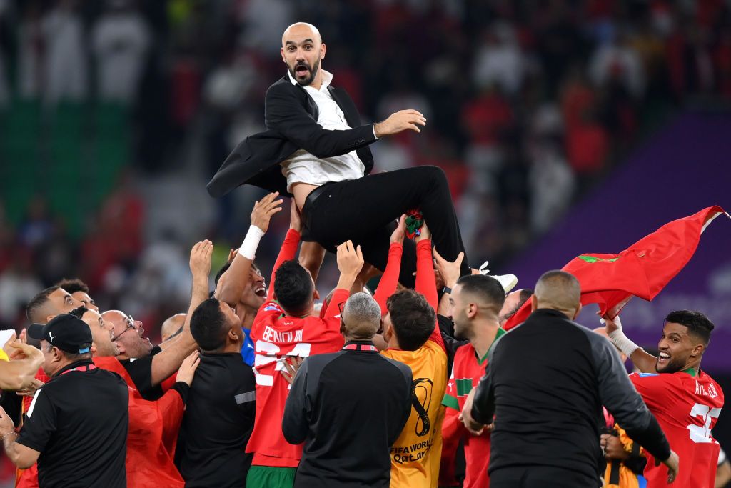 DOHA, QATAR - DECEMBER 10: Walid Regragui, Head Coach of Morocco, celebrates with their team after the team's victory during the FIFA World Cup Qatar 2022 quarter final match between Morocco and Portugal at Al Thumama Stadium on December 10, 2022 in Doha, Qatar. (Photo by Justin Setterfield/Getty Images)