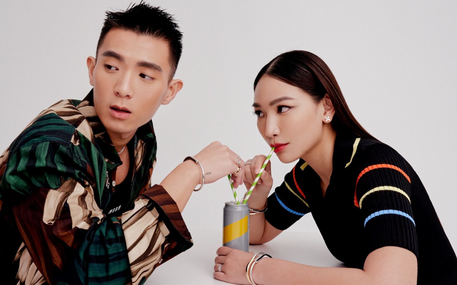 Han Pin Ma wears Tiffany Victoria graduated line necklace, Tiffany Lock bangle, Tiffany & Co. Schlumberger Sixteen Stone ring and Tiffany T True ring; Jane Lau wears Tiffany Victoria earrings, Tiffany Embrace band ring, Tiffany Lock bangles and Tiffany T True wide ring; MSGM outfits