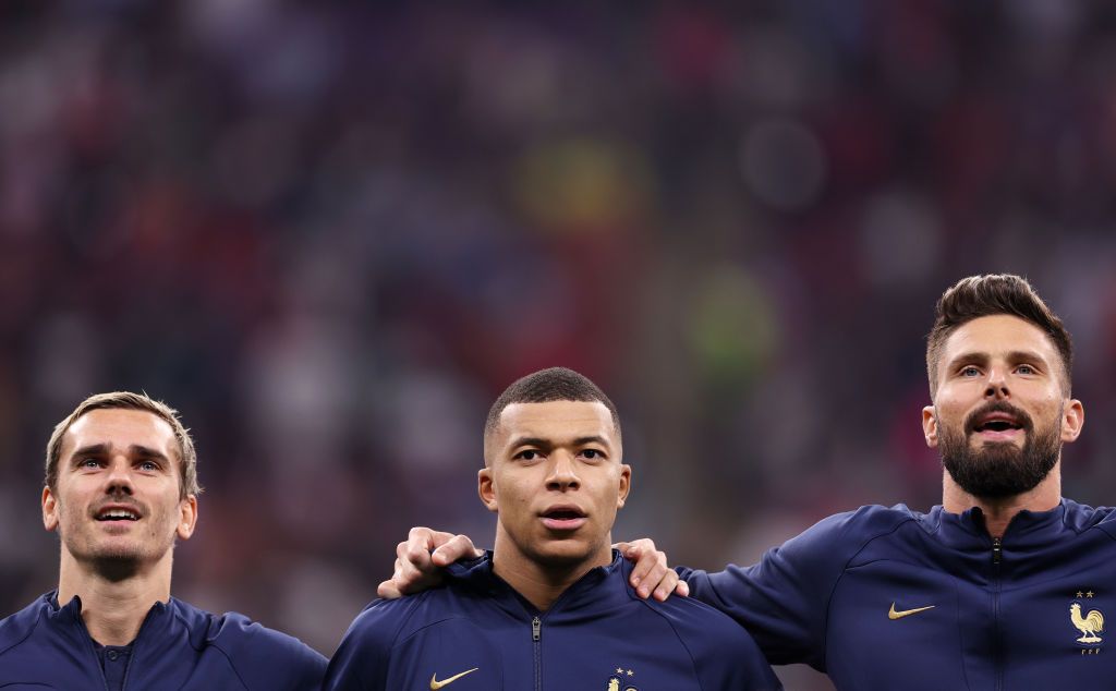 AL KHOR, QATAR - DECEMBER 14: Antoine Griezmann, Kylian Mbappe and Olivier Giroud of France line up for the national anthem prior to the FIFA World Cup Qatar 2022 semi final match between France and Morocco at Al Bayt Stadium on December 14, 2022 in Al Khor, Qatar. (Photo by Maddie Meyer - FIFA/FIFA via Getty Images)