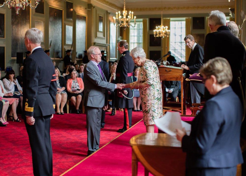 David C. Stewart receives his MBE from the late Queen Elizabeth II
