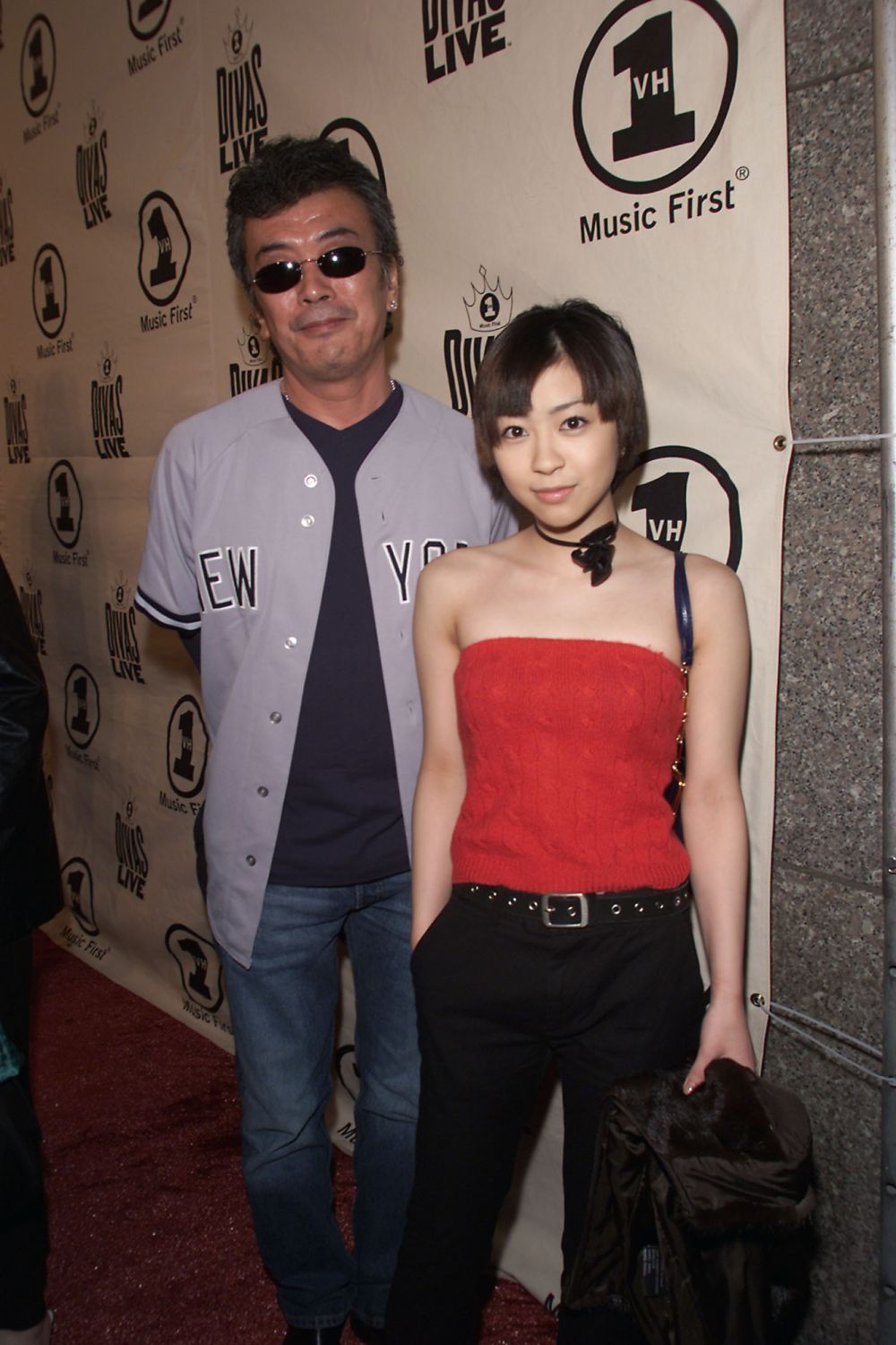 Japanese singer Hikaru Utada (Hikki) with her father arrives for the 'VH1 Divas Live: The One and Only Aretha Franklin' at Radio City Music Hall in New York City, 4/9/01. The show airs live on VH1 on Tuesday, April 11, 2001 at 9:00PM EST. Photo by Frank Micelotta/Getty Images.