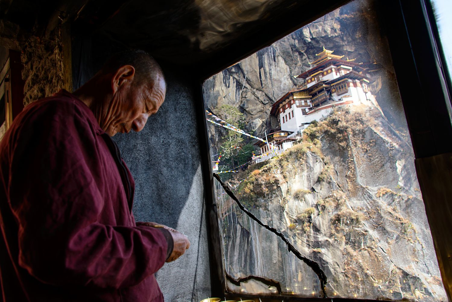 Amankora, Bhutan â Experience, Excursion, Monk in prayer at Tiger's Nest