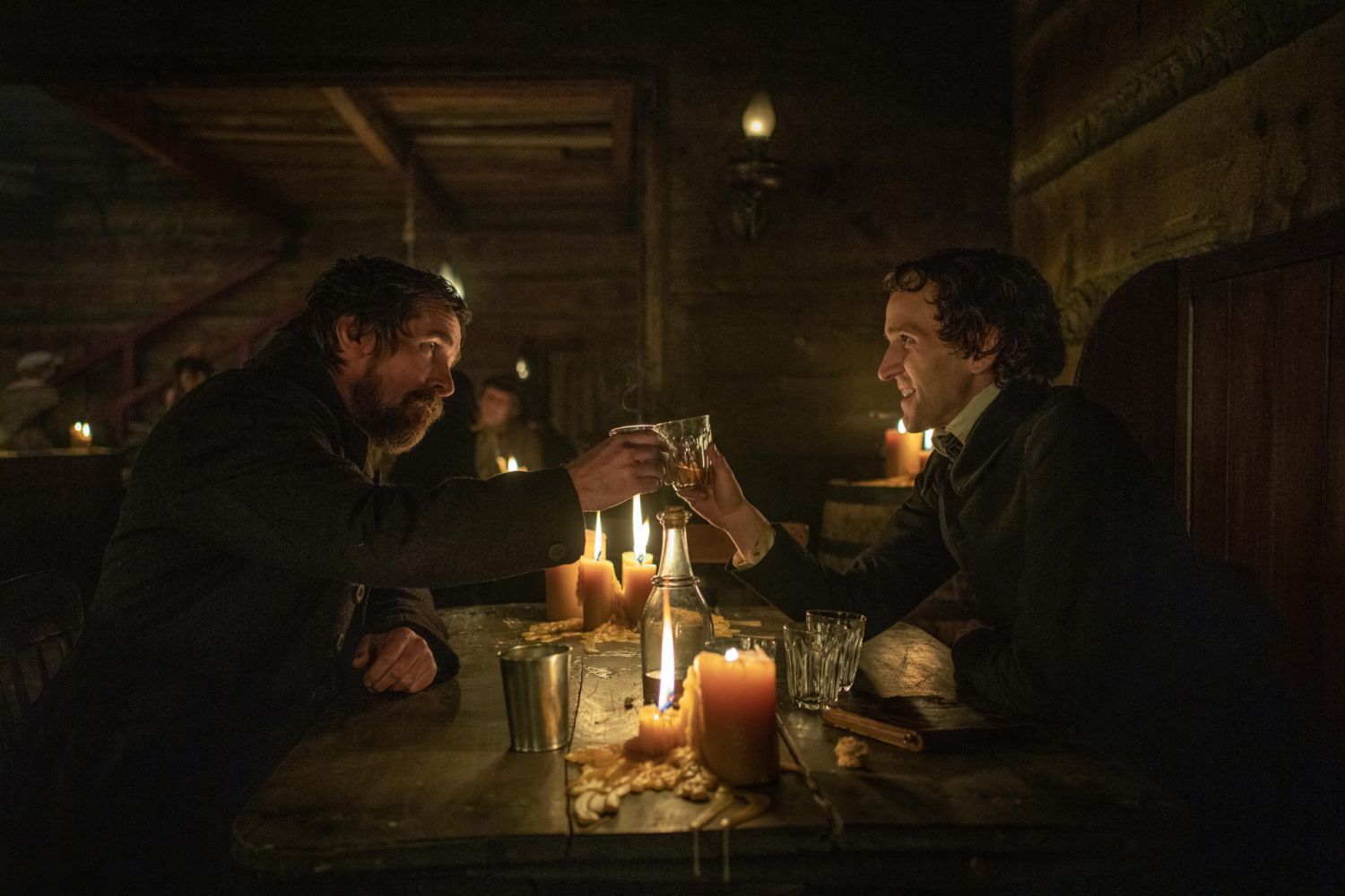 The Pale Blue Eye. (L to R) Christian Bale as Augustus Landor and Harry Melling as Edgar Allen Poe in The Pale Blue Eye. Cr. Scott Garfield/Netflix © 2022