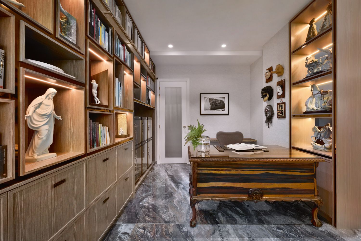 The husband’s study has many stories to tell with its array of books, Lladró figurines, and souvenirs