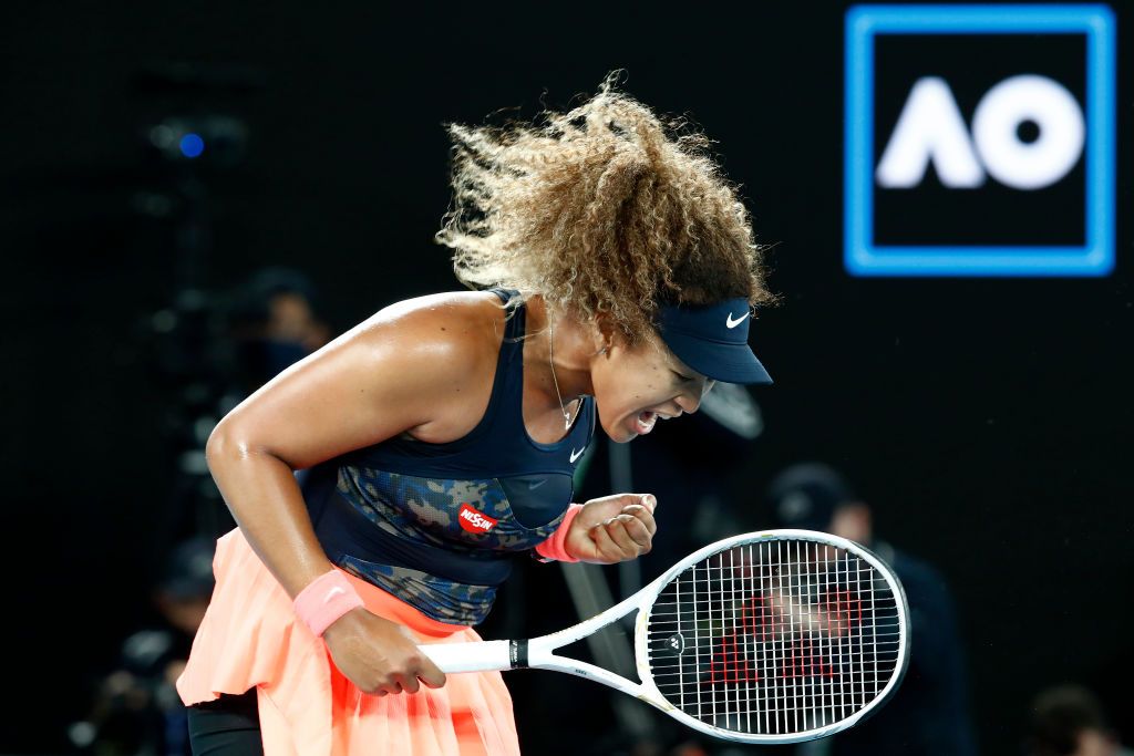 MELBOURNE, AUSTRALIA - FEBRUARY 20: Naomi Osaka of Japan celebrates winning a point in her Womenâs Singles Final match against Jennifer Brady of the United States during day 13 of the 2021 Australian Open at Melbourne Park on February 20, 2021 in Melbourne, Australia. (Photo by Darrian Traynor/Getty Images)