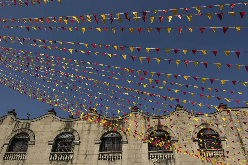 INTRAMUROS, MANILA, METRO MANILA, PHILIPPINES - 2014/05/19: Flags are spread out at San Augustin church in Intramuros Manila. Philippines, Intramuros. (Photo by Thierry Falise/LightRocket via Getty Images)