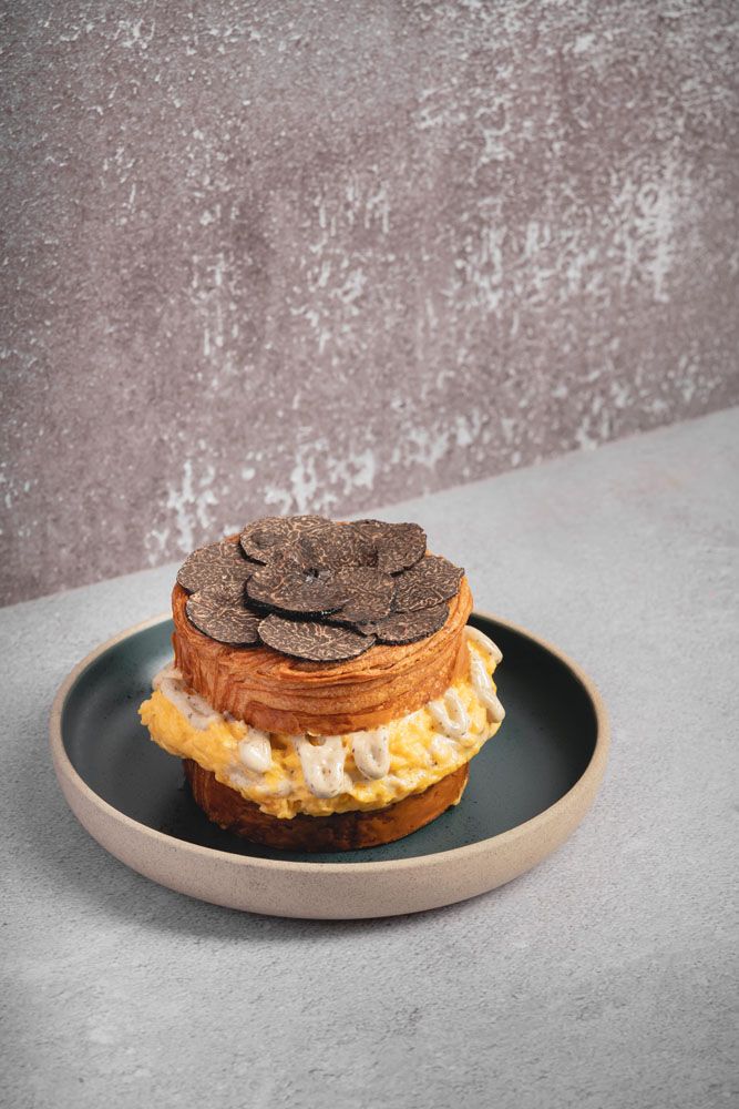 Black truffle scrambled eggs croissants