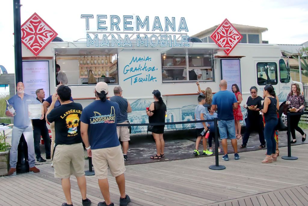 ATLANTIC CITY, NJ - AUGUST 31: The public enjoys the food and drink from Dwayne "The Rock" Johnson's Great American Mana Mobile at AC Boardwalk across from Hard Rock Atlantic City Hotel Casino for a fundraiser to benefit the AC Police, AC Firefiighters and EMT's on August 31, 2021 in Atlantic City, New Jersey. (Photo by Donald Kravitz/Getty Images)