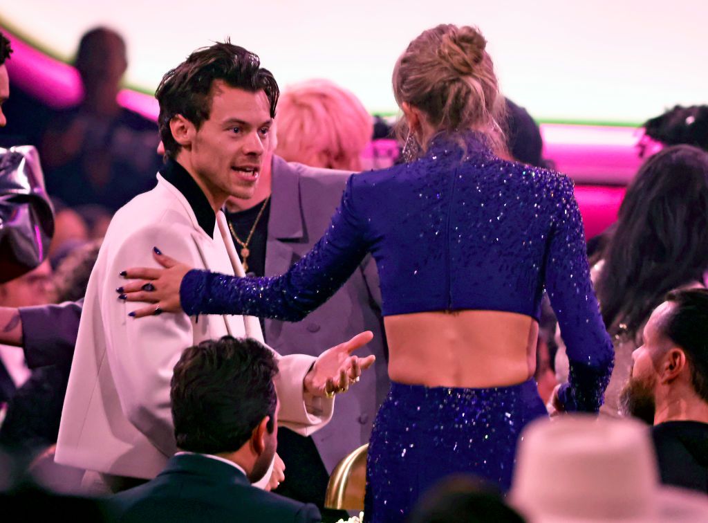 LOS ANGELES, CALIFORNIA - FEBRUARY 05: (FOR EDITORIAL USE ONLY) (L-R) Harry Styles and Taylor Swift speak during the 65th GRAMMY Awards at Crypto.com Arena on February 05, 2023 in Los Angeles, California. (Photo by Frazer Harrison/Getty Images)