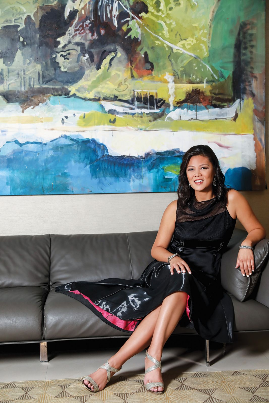 Benitez in front of a large luscious landscape, which she completed during her Artist Residency at the Crystal Bridges Museum in Bentonville Arkansas in 2018