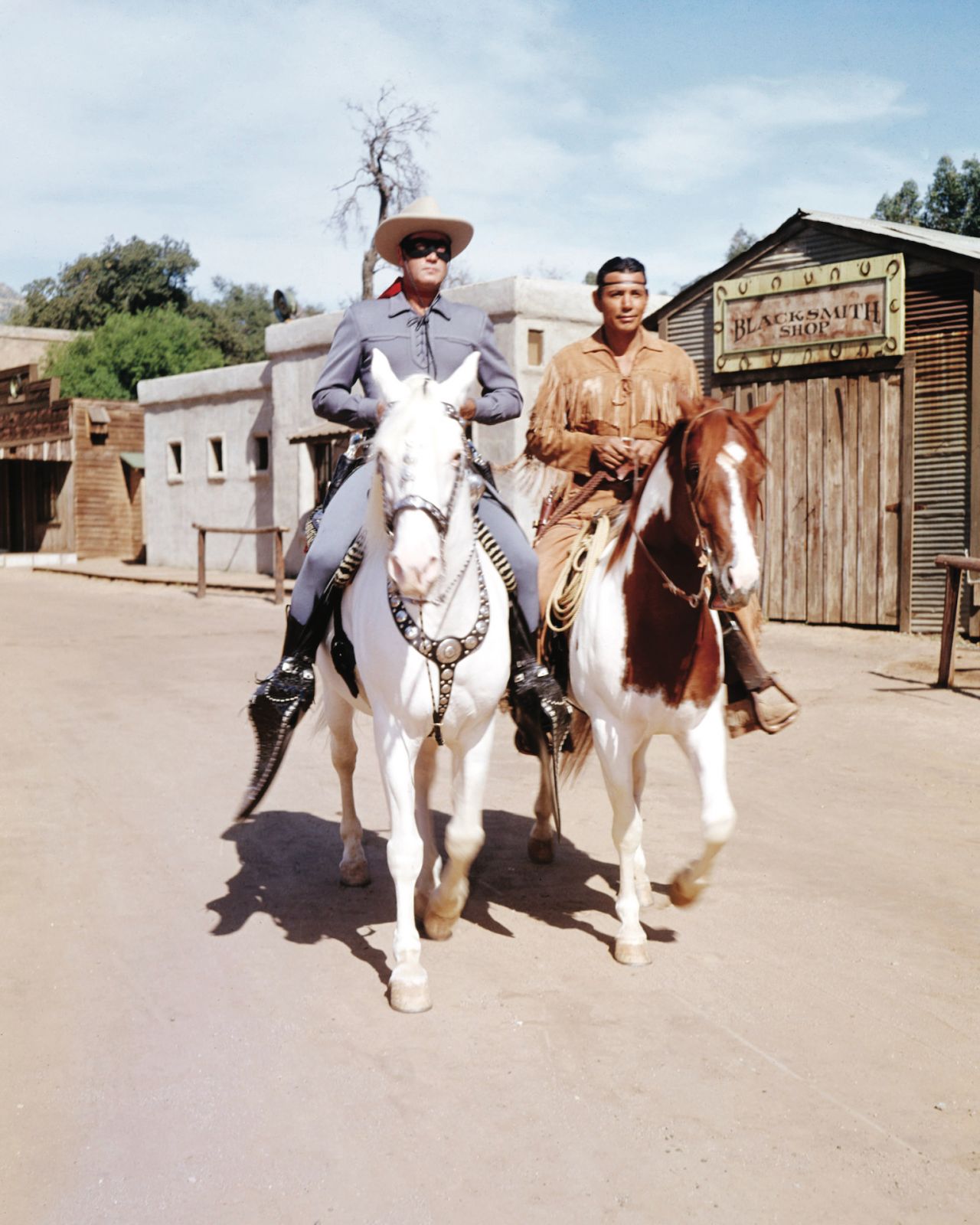 Clayton Moore (1914-1999), US actor, in costume, riding his horse, 'Silver', alongside Jay Silverheels (1912-1980), Canadian Mohawk actor, in costume on his horse, 'Scout', in a publicity still issued for the television series, 'The Lone Ranger', USA, circa 1950. The adventure series starred Moore as 'The Lone Ranger', and Silverheels as 'Tonto'. (Photo by Silver Screen Collection/Getty Images)