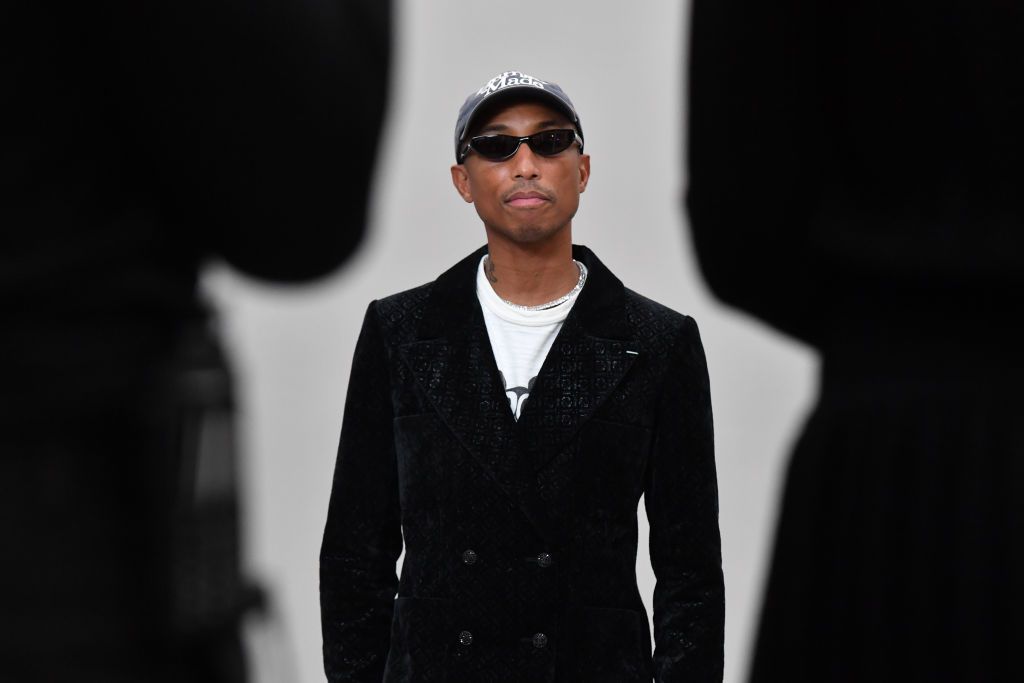 PARIS, FRANCE - DECEMBER 07: (EDITORIAL USE ONLY - For Non-Editorial use please seek approval from Fashion House). Pharrell Williams attends the Chanel Metiers D'Art 2021-2022 show at Le 19M on December 07, 2021 in Paris, France. (Photo by Stephane Cardinale - Corbis/Corbis via Getty Images)