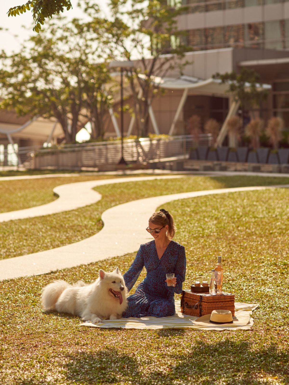 The lush greenery surrounding the hotel contrasts nicely with its modern aesthetics