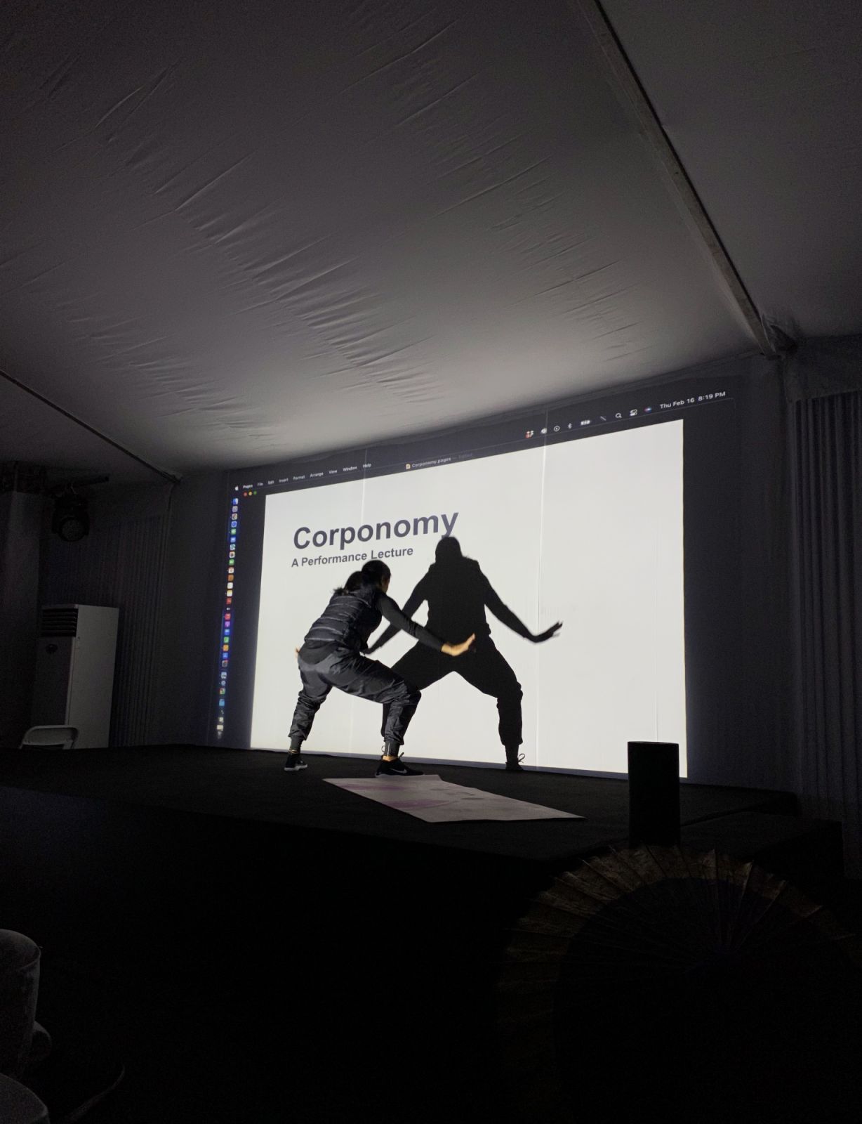 Eisa Jocson warming up for her performance lecture Corponomy.