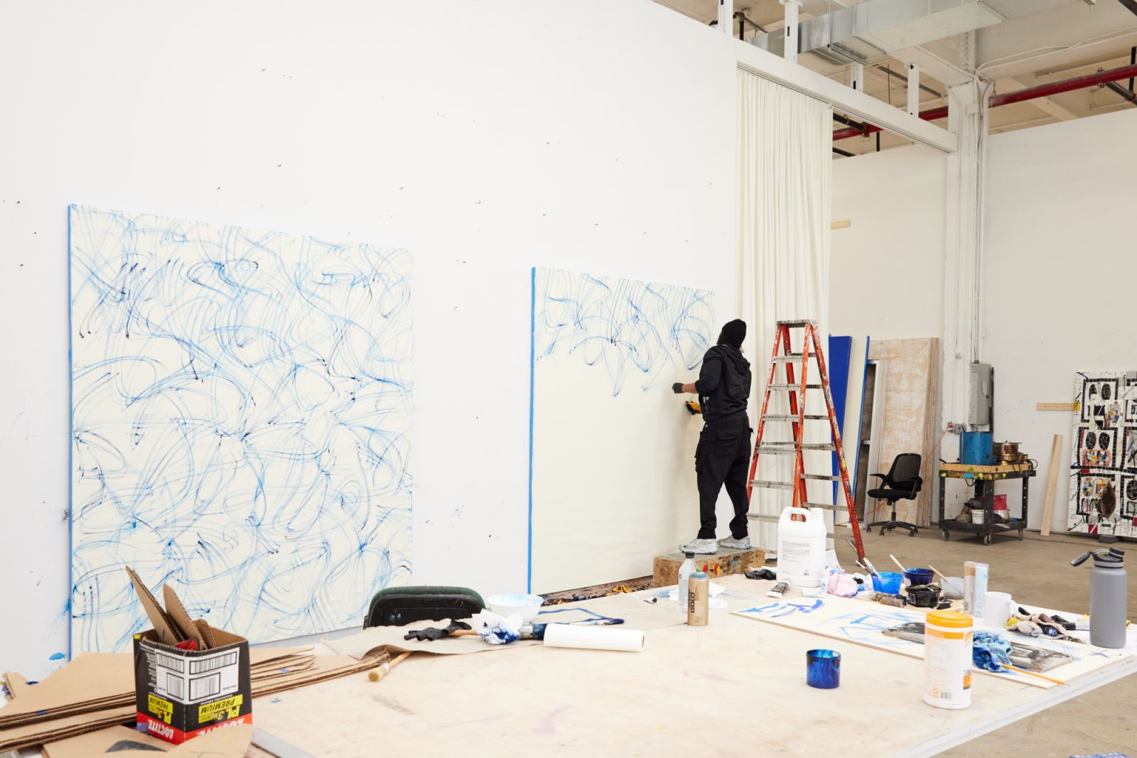Johnson at work on new bruise paintings (Photo: Masato Onoda)