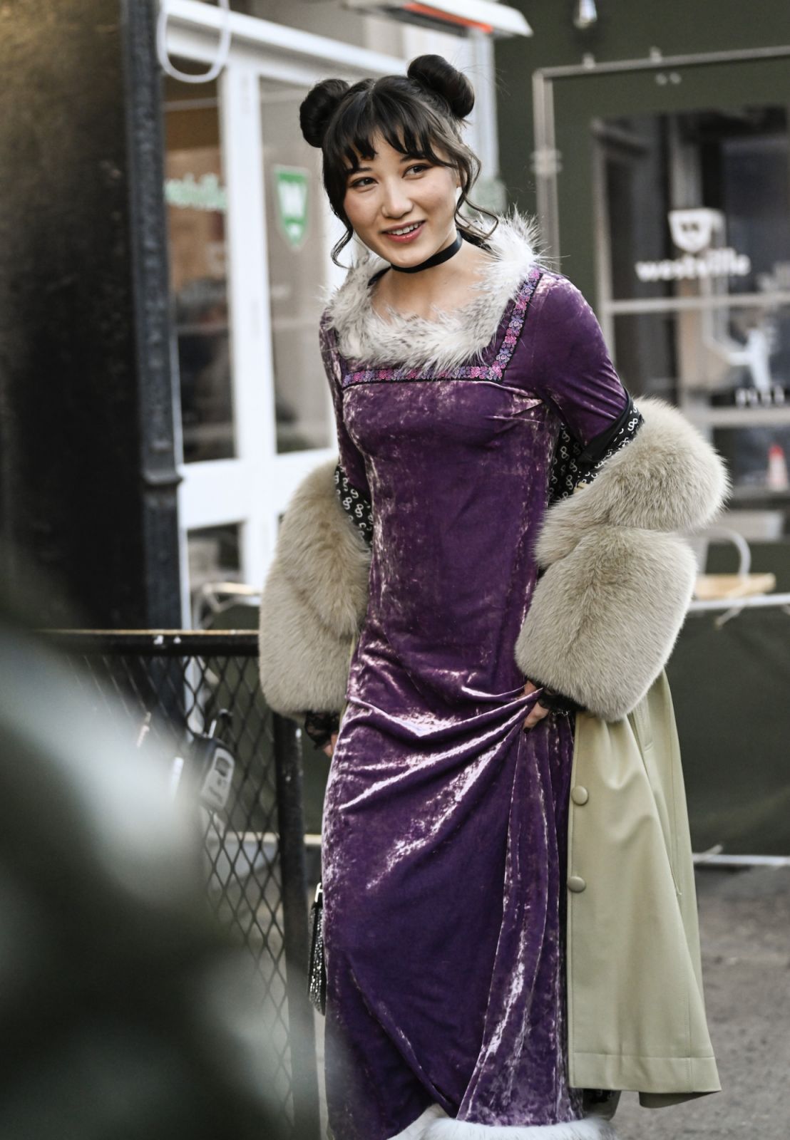 NEW YORK, NEW YORK - FEBRUARY 11: A guest is seen wearing a purple Anna Sui dress outside the Anna Sui show during New York Fashion Week F/W 2023 on February 11, 2023 in New York City. (Photo by Daniel Zuchnik/Getty Images)