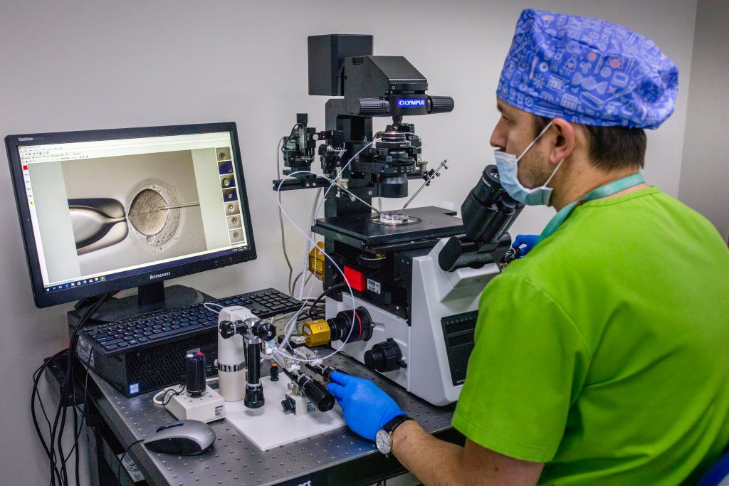 TBILISI, GEORGIA - 2019/12/19: Inside a lab at a clinic in Tbilisi, Georgia, Doctor Jordan from Spain, is doing an artificial insemination into an egg that later will be planted into a Georgian surrogate mother.The country of Georgia has become a hub for the international surrogate industry, driven by the poverty of domestic surrogate mothers and the desire of foreign customers to have a child. (Photo by Jonas Gratzer/LightRocket via Getty Images)
