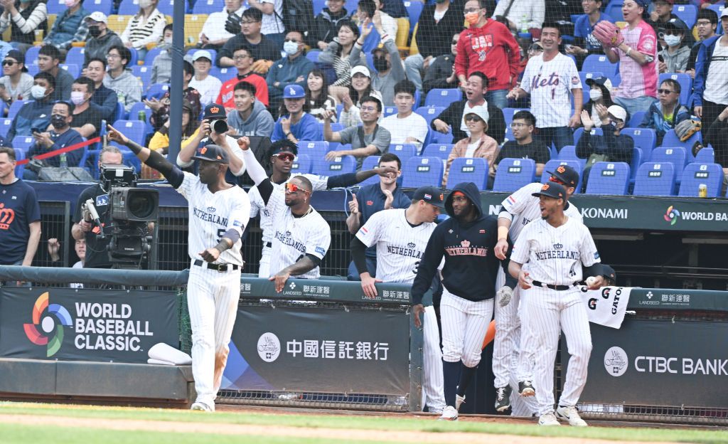 TAICHUNG, TAIWAN - MARCH 08: Team Celebrate after Joshua Palacios #77 of Team Netherlands hit a RBI single at the bottom of the 6th inning during the World Baseball Classic Pool A game between Cuba and Netherlands at Taichung Intercontinental Baseball Stadium on March 08, 2023 in Taichung, Taiwan. (Photo by Gene Wang/Getty Images)