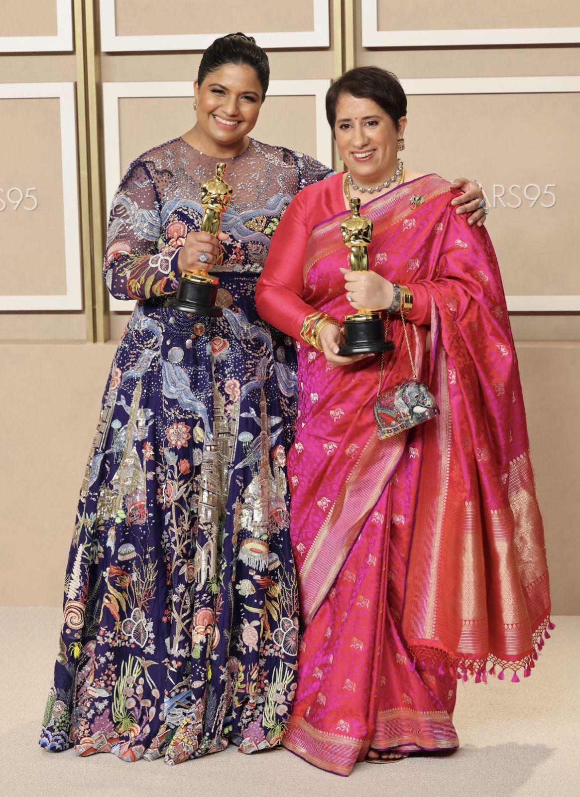HOLLYWOOD, CALIFORNIA - MARCH 12: Kartiki Gonsalves and Guneet Monga, winners of the Best Documentary Short Film award for "The Elephant Whisperers," pose in the press room during the 95th Annual Academy Awards at Ovation Hollywood on March 12, 2023 in Hollywood, California. (Photo by Rodin Eckenroth/Getty Images)
