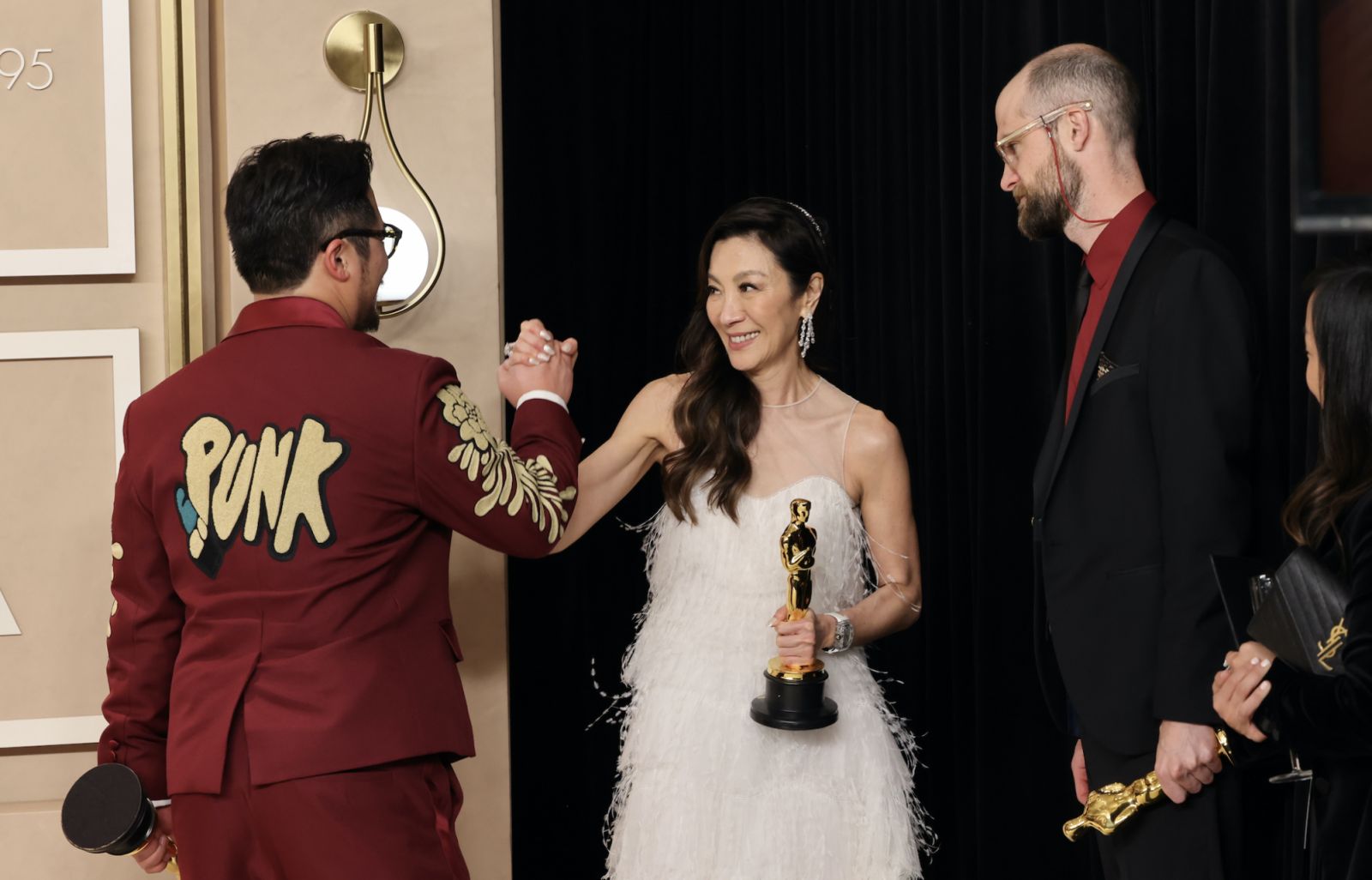 HOLLYWOOD, CALIFORNIA - MARCH 12: Daniel Kwan and Daniel Scheinert, winners of the Best Director award for âEverything Everywhere All at Onceâ and Michelle Yeoh, winner of the Best Actress in a Leading Role award for âEverything Everywhere All at Onceâ in the press room during the 95th Annual Academy Awards at Ovation Hollywood on March 12, 2023 in Hollywood, California. (Photo by Rodin Eckenroth/Getty Images)