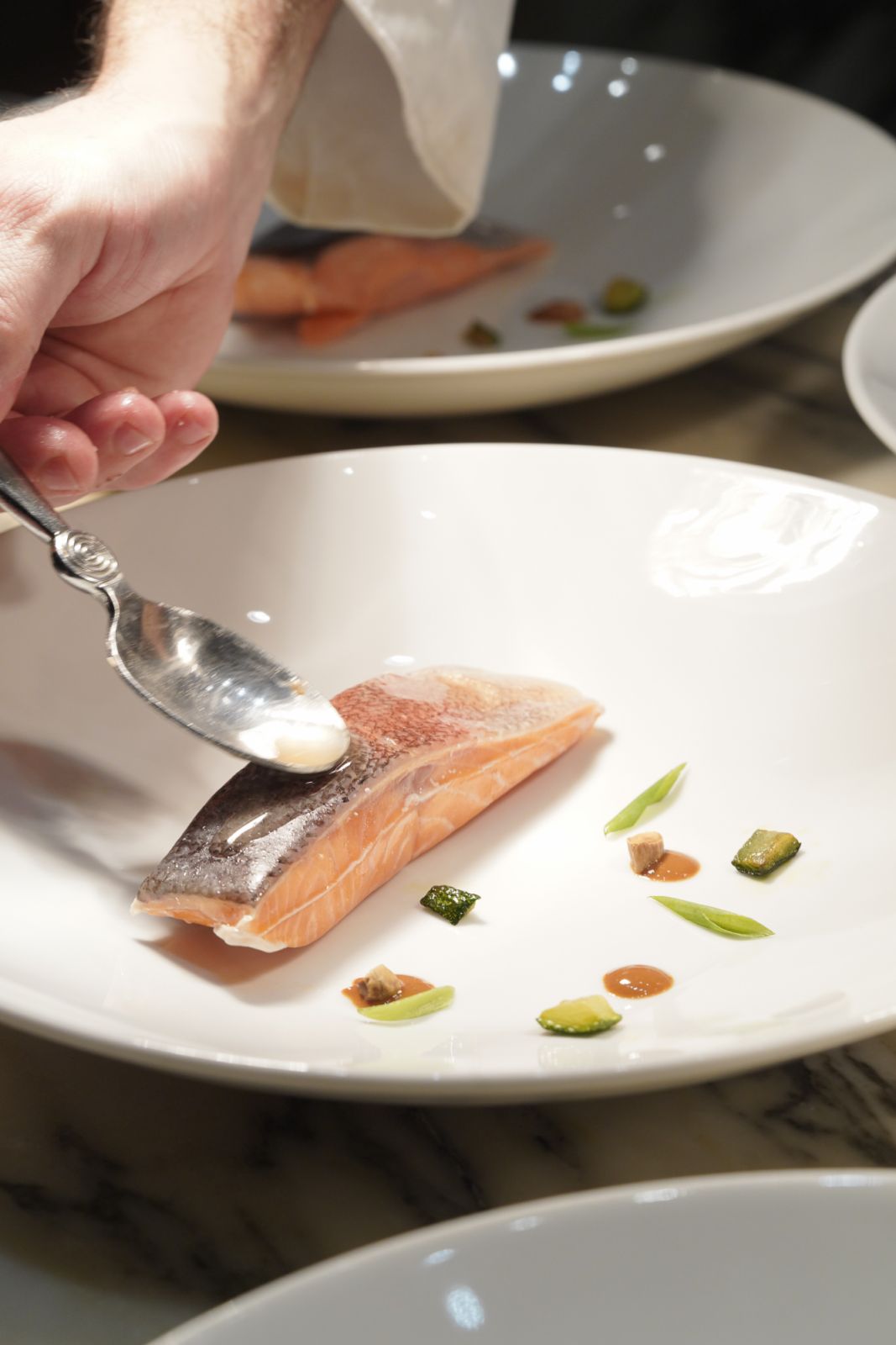 Poached trout with scallions and almonds