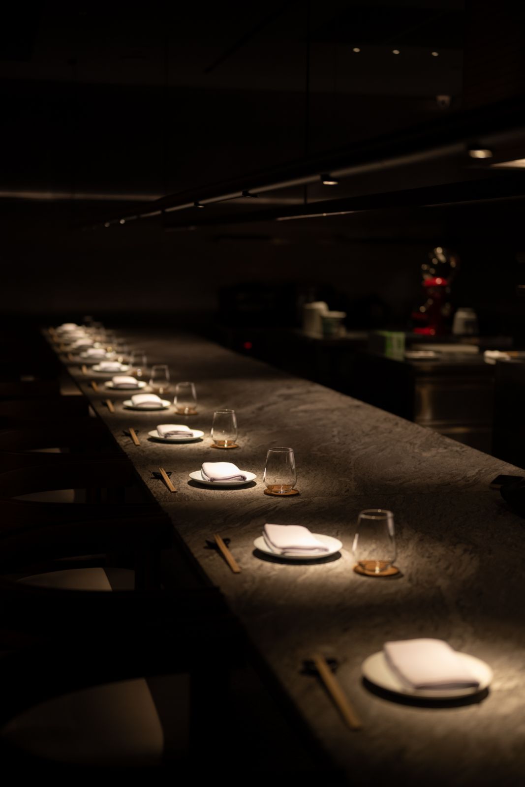 The moodily lit counter at Okaju