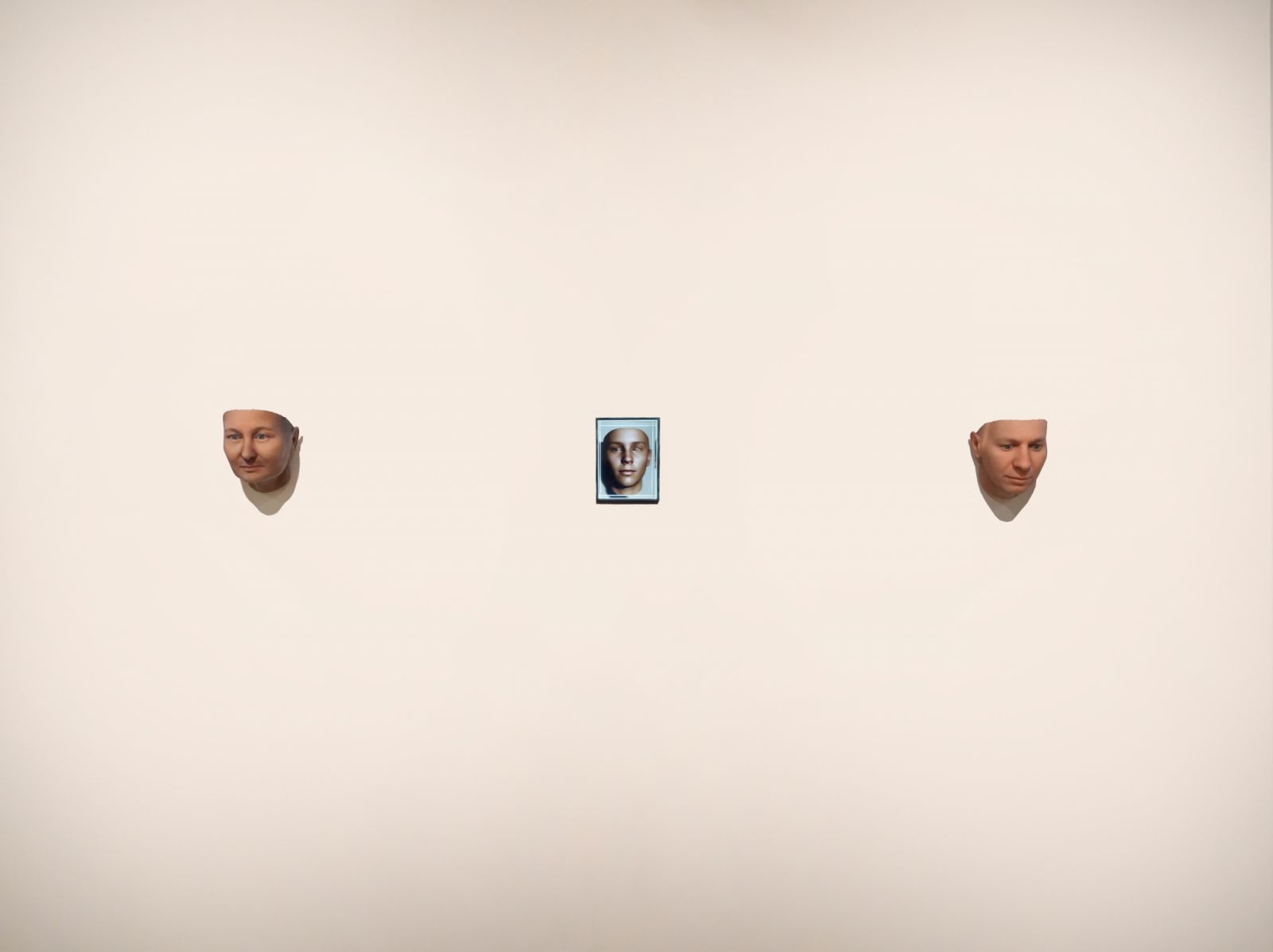 "Watson's Ghost" (2021) by Heather Dewey-Hagborg; Two 3D-printed masks and a holographic video in-between. (Image: Wei-Ling Gallery)