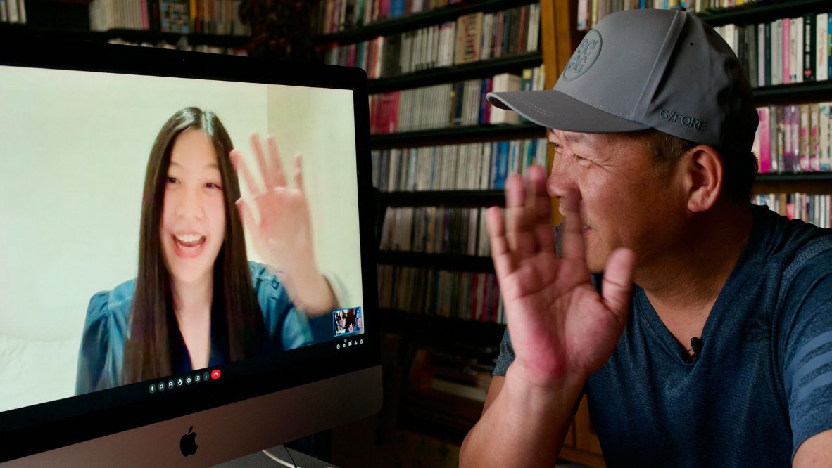 Taiwanese designer Xiao Qing-yang speaks with his daughter Hsiao Chun-tien during an AFP interview after the duo won a Grammy for best recording package (Photo: AFP)